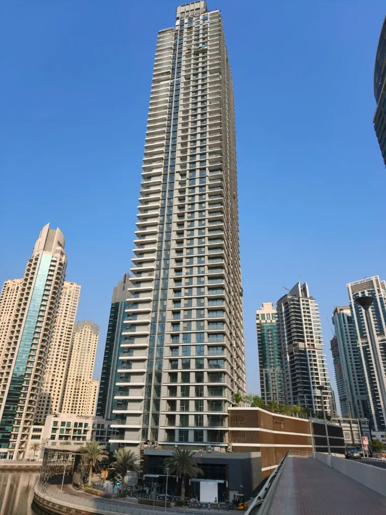 Residential tower under construction photographed from street level